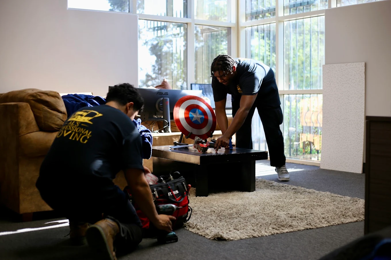 Al's Professional Moving crew handling furniture